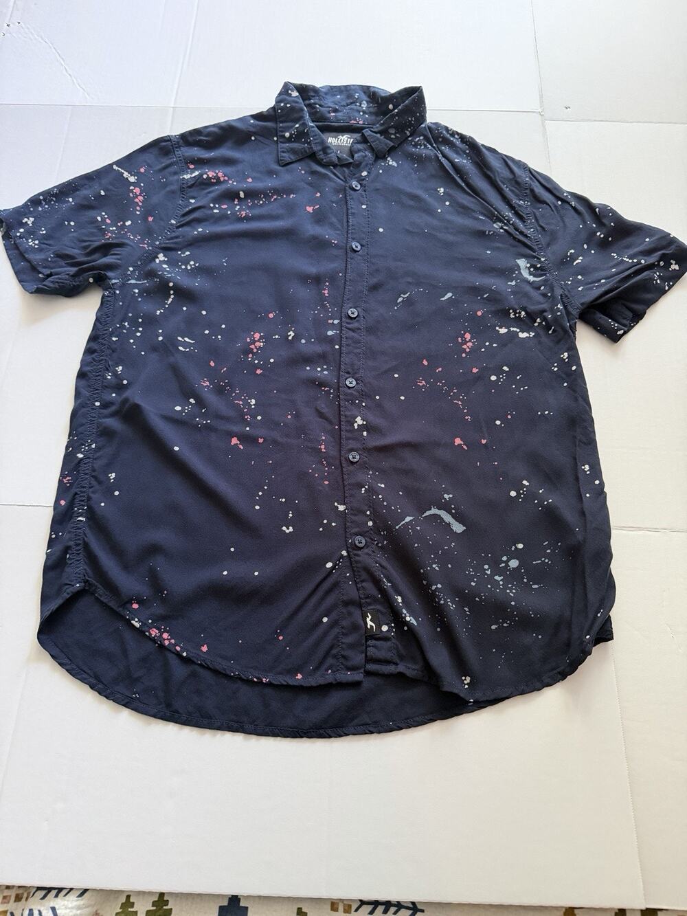 Hollister short-sleeve button-up shirt featuring a distinctive paint splatter